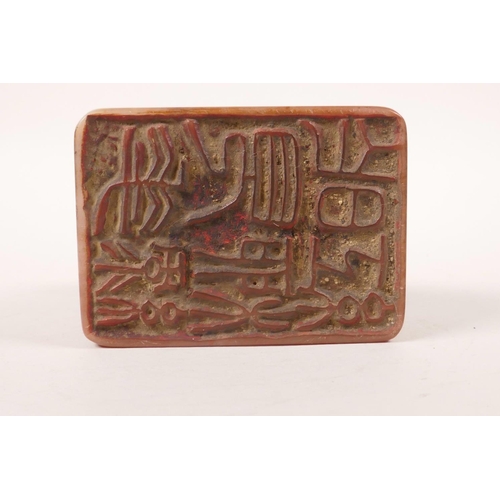 250 - A Chinese soapstone seal with a carved knop in the form of a stag, boxed, 2½