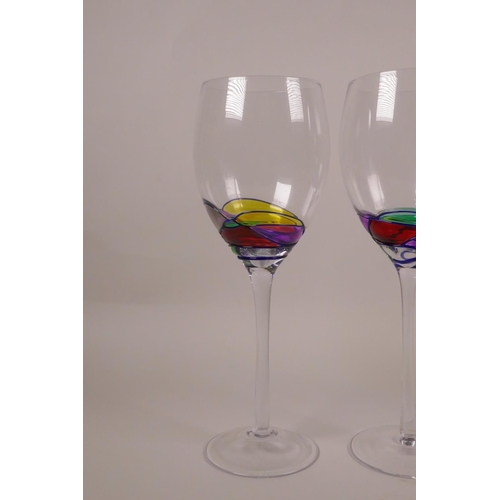 253 - Four wine glasses with polychrome swirl decoration, 9