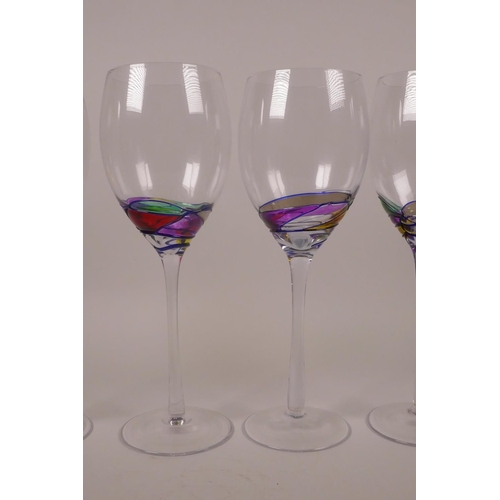 253 - Four wine glasses with polychrome swirl decoration, 9