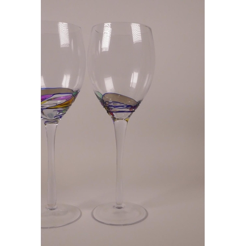 253 - Four wine glasses with polychrome swirl decoration, 9