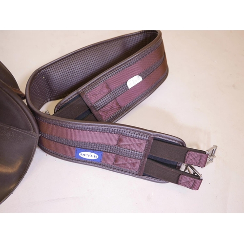 259 - A Wintec Cair brown GP saddle with leather girth straps, stirrup leathers and irons, very good condi... 