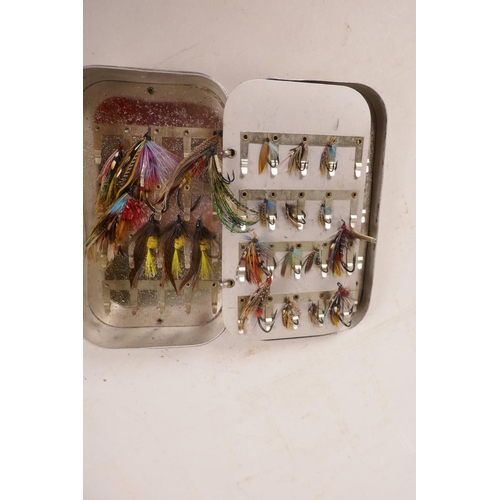 276 - A vintage aluminium fly box containing multiple salmon flies