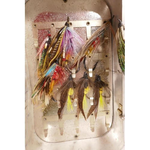 276 - A vintage aluminium fly box containing multiple salmon flies