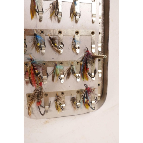 276 - A vintage aluminium fly box containing multiple salmon flies