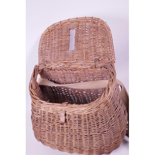 30 - A vintage woven wicker fishing basket, 11