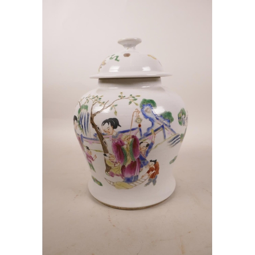 300 - A Chinese polychrome porcelain jar and cover decorated with women and children in a garden, 8½