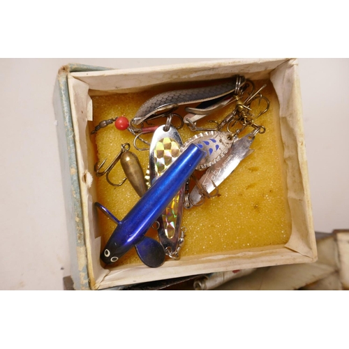 314 - A vintage box of fishing lures and hooks, and another