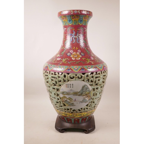 320 - A Chinese polychrome porcelain reticulated vase with decorative landscape panels to body and floral ... 