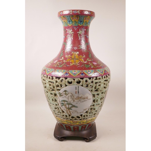 320 - A Chinese polychrome porcelain reticulated vase with decorative landscape panels to body and floral ... 