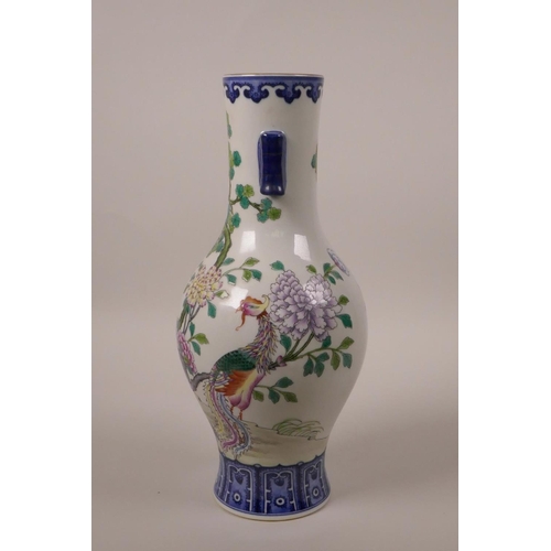 33 - A Chinese polychrome porcelain vase with two lug handles, decorated with Asiatic birds and butterfli... 