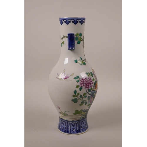 33 - A Chinese polychrome porcelain vase with two lug handles, decorated with Asiatic birds and butterfli... 