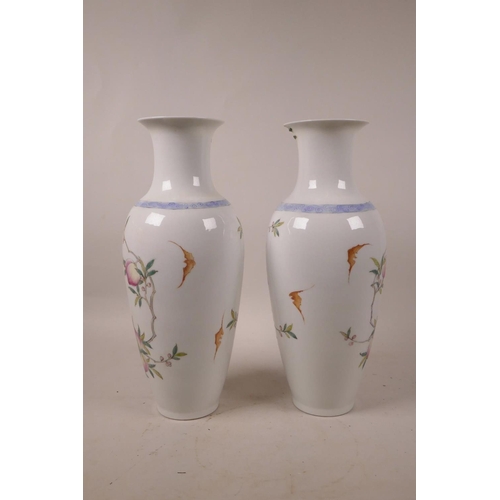 348 - A pair of Chinese polychrome porcelain vases with peach tree decoration, 6 character mark to base, A... 