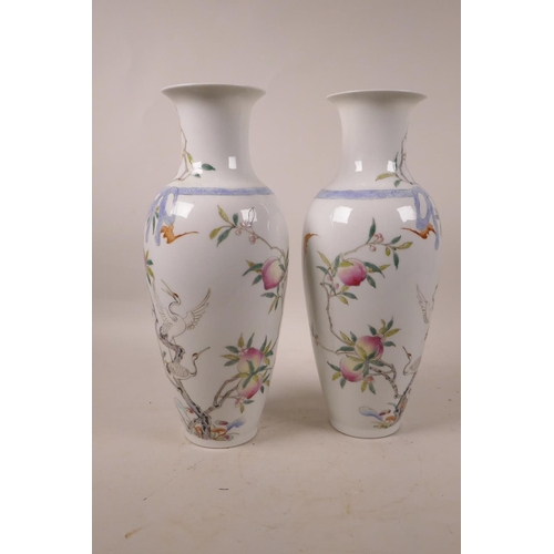 348 - A pair of Chinese polychrome porcelain vases with peach tree decoration, 6 character mark to base, A... 