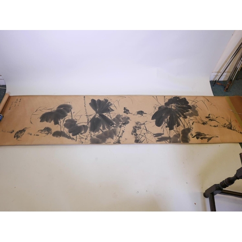 353 - A large Chinese watercolour scroll depicting birds amongst flowers, approximately 110