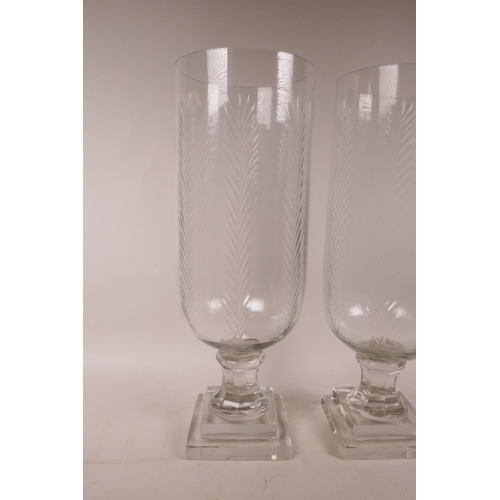 355 - A pair of large glass hurricane vases, 16