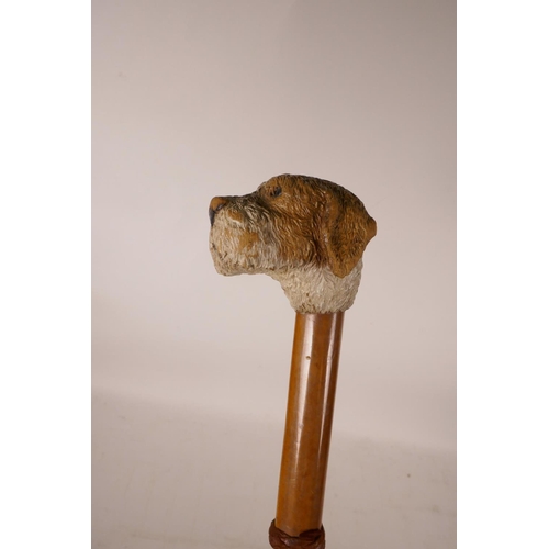 356 - A carved and painted parasol handle in the form of a dog's head, 33½