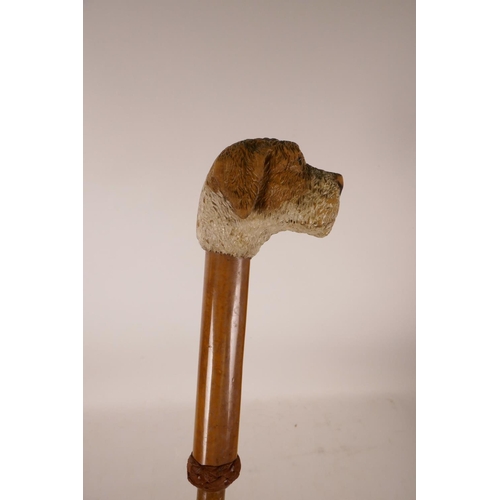 356 - A carved and painted parasol handle in the form of a dog's head, 33½