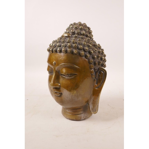 358 - A Chinese filled bronze Buddha head, character mark to base, 7½