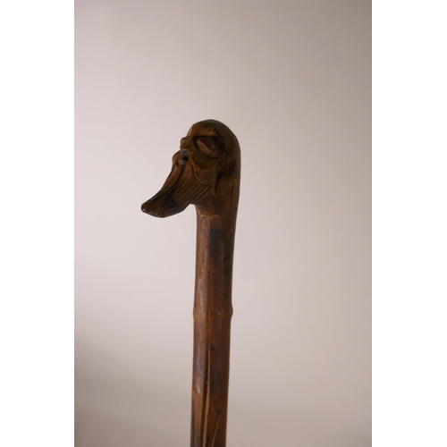 372 - A Chinese walking cane with carved sage head decoration to handle, 40