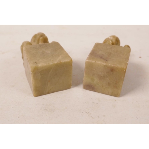 373 - A pair of Chinese carved soapstone seal blanks with fo dog knops, 1½