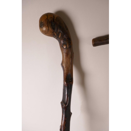 384 - A blackthorne walking stick, a bamboo walking stick, and another, longest 34½