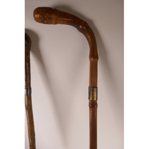 384 - A blackthorne walking stick, a bamboo walking stick, and another, longest 34½