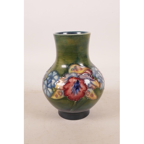 386 - A Moorcroft pottery green ground flower vase, 5