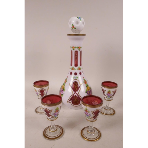 392 - A Bohemian white cased red glass liquer set of decanter and four glasses, painted with flowers in br... 