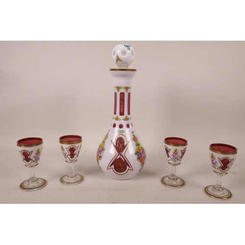 392 - A Bohemian white cased red glass liquer set of decanter and four glasses, painted with flowers in br... 