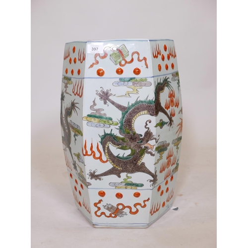 397 - A Chinese famille verte ceramic garden stool with red dragon decoration, A/F, crack to base, 20