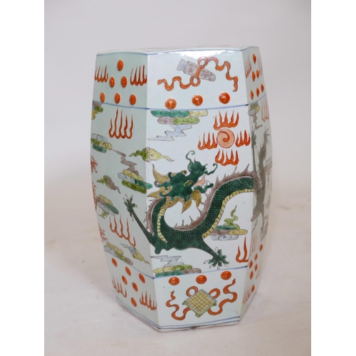 397 - A Chinese famille verte ceramic garden stool with red dragon decoration, A/F, crack to base, 20