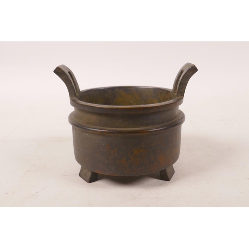 398 - A Chinese bronze two handled censer, impressed character marks to base, 3½