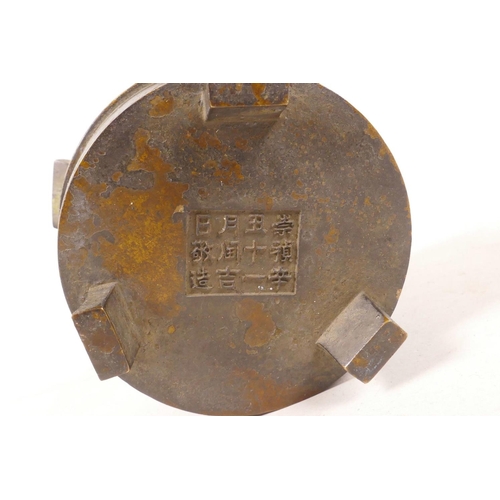 398 - A Chinese bronze two handled censer, impressed character marks to base, 3½