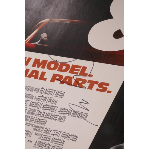 414 - A 'Fast and Furious' (4) mounted film poster, signed by Paul Walker and Vin Diesel, 40