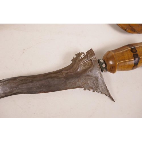 419 - An Indonesian kris dagger with a watered blade and splatted tamarind wood sheath and handle, 24