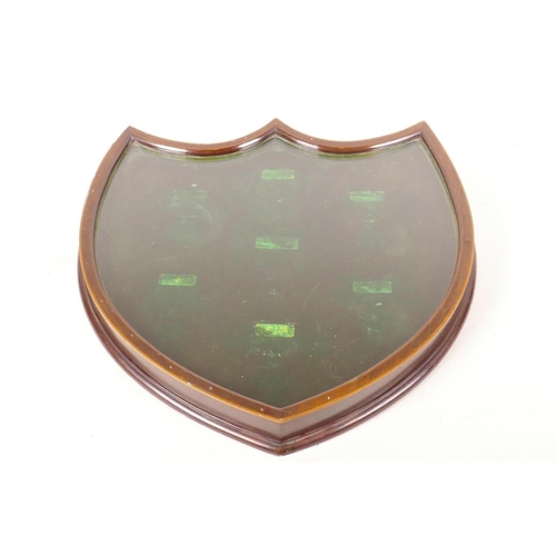 432 - A small shield shaped inlaid mahogany display case, 13½