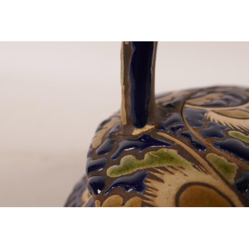 438 - A Japanese redware pottery teapot possibly by Kozan, with cursive blue and cream foliate decoration,... 