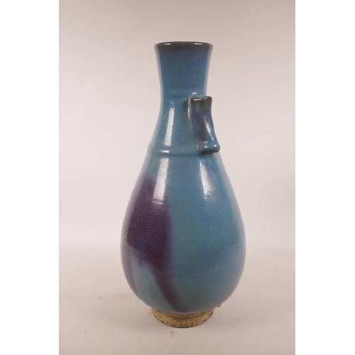 439 - A Chinese Jun kiln pottery vase with two lug handles, 15½