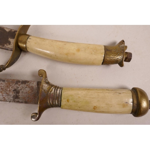 44 - An Oriental dagger with curved blade, bone handle and brass mounts, 12