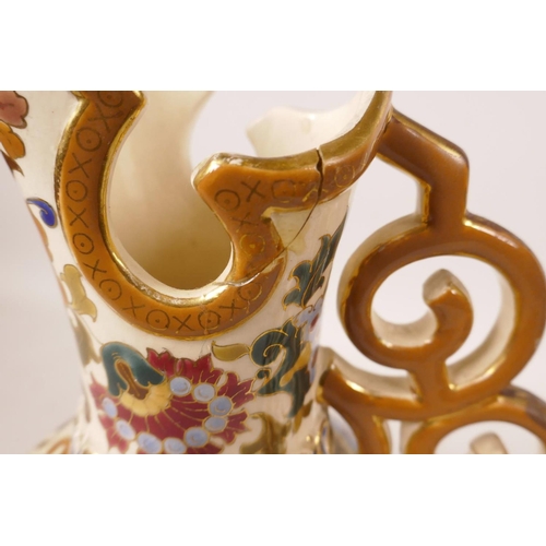 442 - A pair of Austrian porcelain ewers by Jos Steidl Znaim, with Zsolnay style decoration, A/F, 9½