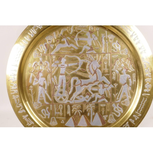 448 - A quantity of decorative brassware, an Egyptian brass tray decorated with copper and white metal, 15... 