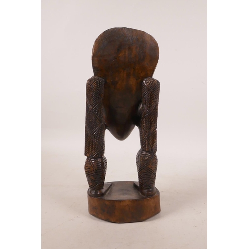 455 - An African Congolese carved wood figure, 10