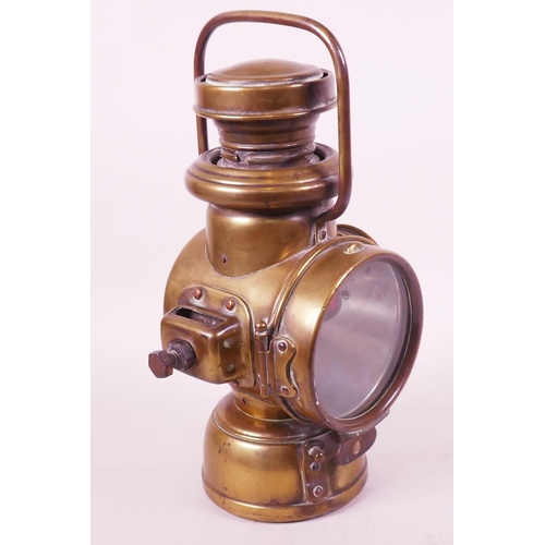 472 - A Powell and Hammer Ltd brass cased carbide near side vehicle lamp, 10½