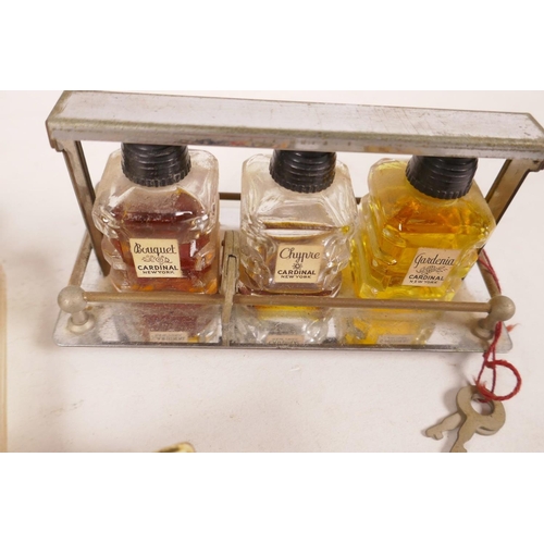 474 - A small plated perfume tantalus with padlock and keys, 4½