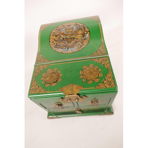 475 - A Chinese green lacquered vanity box with rising mirror and three drawers, with gilt and dragon deco... 