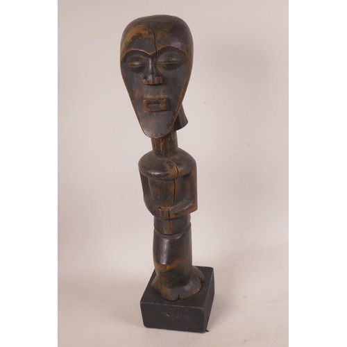 478 - An African carved wood ritual figurine, 13