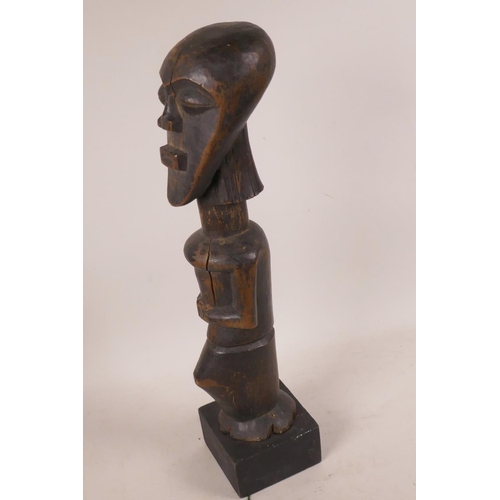 478 - An African carved wood ritual figurine, 13