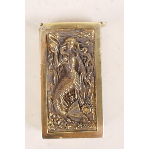 486 - A brass vesta case with raised decoration of a mermaid, 2