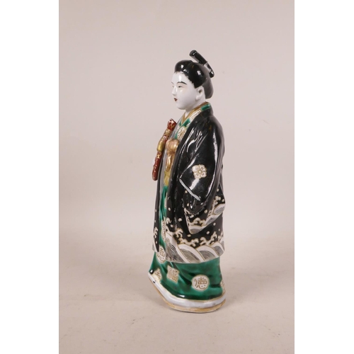 497 - A Japanese porcelain figure in a black robe, A/F repair, 10