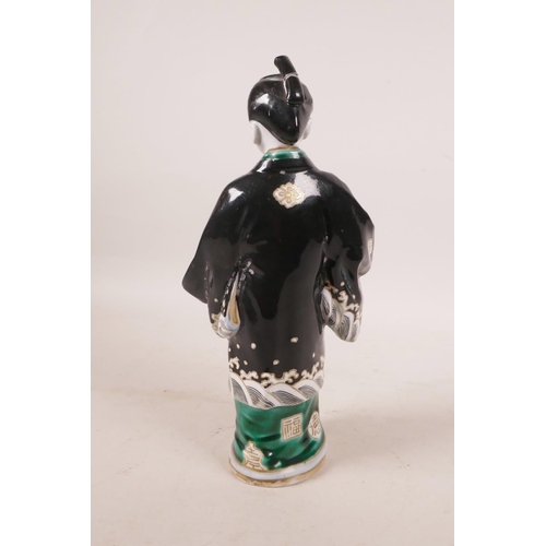 497 - A Japanese porcelain figure in a black robe, A/F repair, 10